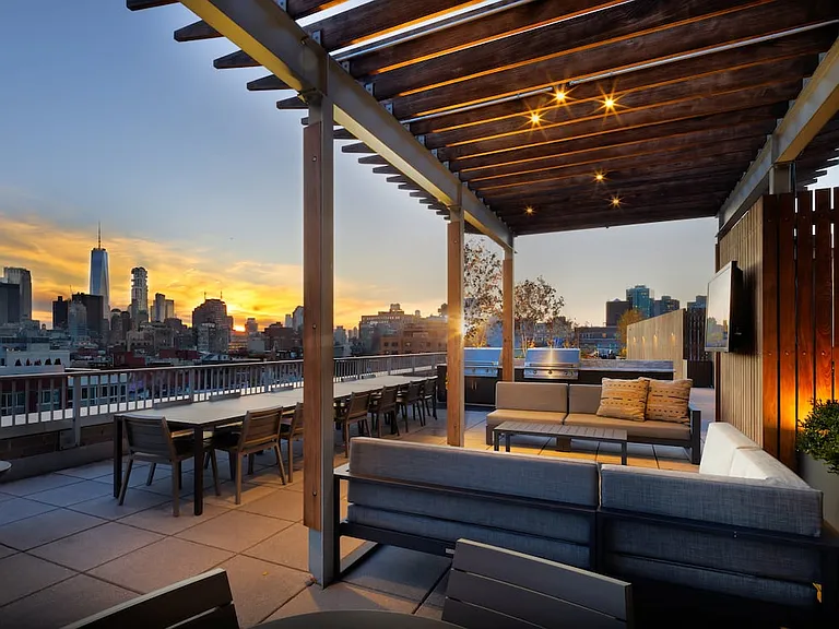Rooftop terrace with lounge seating and grilling stations