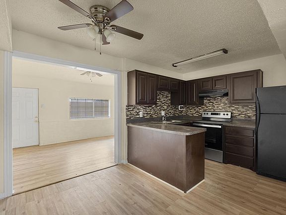 Kitchen + Dining area looking into flex room