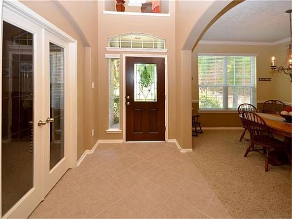 Upon entering, you'll find the study to the left and formal dining room to the right.