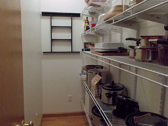 The kitchen is complimented with a large walk in pantry.