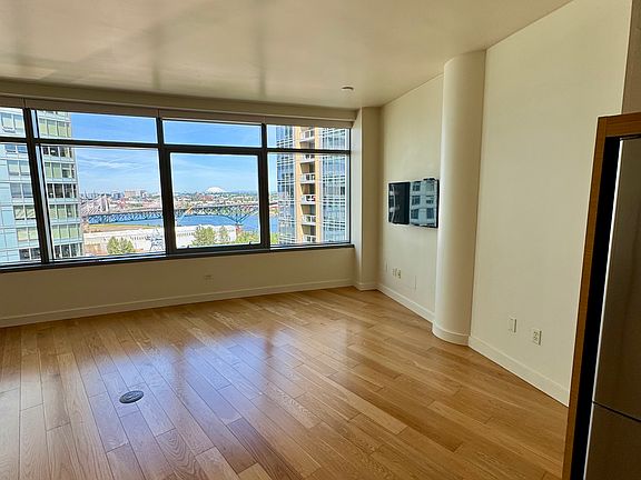 Bright, open studio layout with stunning city and mountain views.