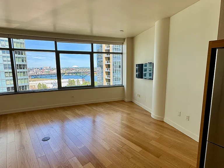 Bright, open studio layout with stunning city and mountain views.