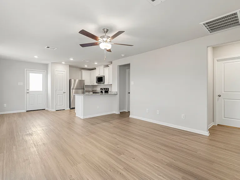 A spacious family room and kitchen.