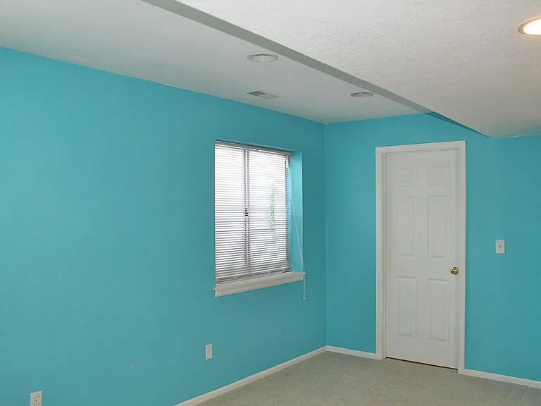 Large flex space in basement is 16' by 12' 2" and the door goes to large storage area