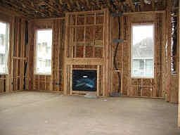 Living room with fireplace and huge windows