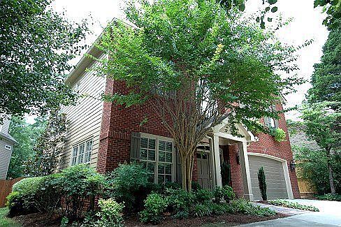 This exquisite home has a large circular drive with plenty of room for parking