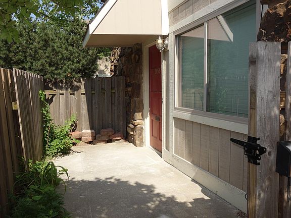 Just inside the front gate you have a small front patio area.