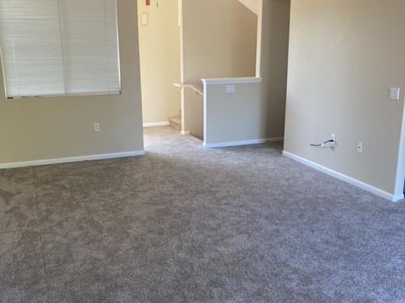 2nd level great room, kitchen, guest bathroom and balcony