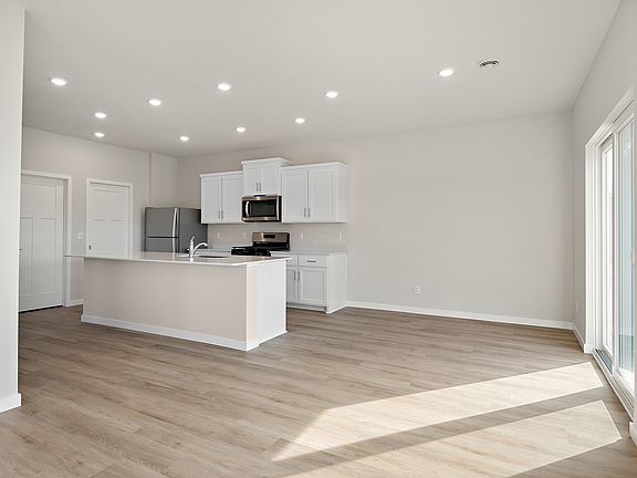 The kitchen is open to the dining room and family room.