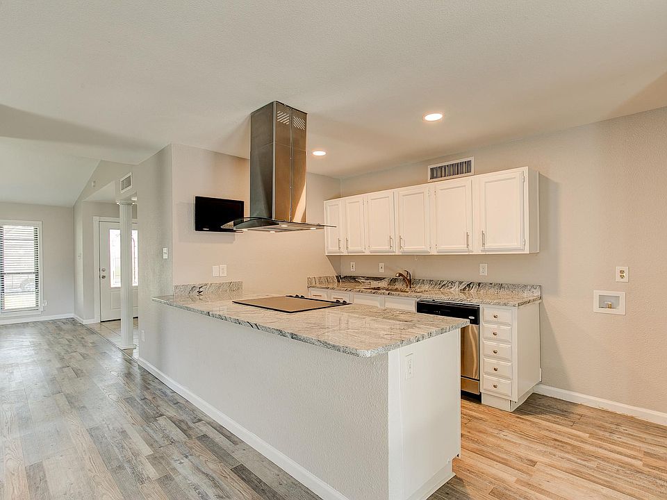 The kitchen is the heart of this charming home.