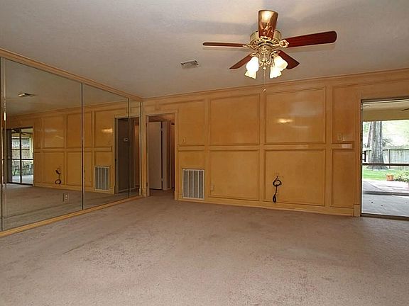 Spacious living room is the perfect place for your next gathering and offers a variety of furniture options.