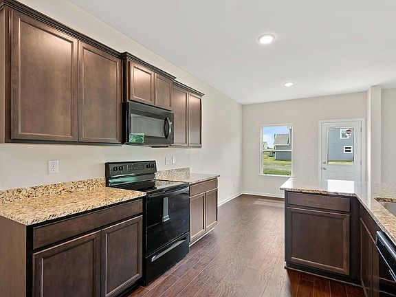 The kitchen comes with a full suite of energy-efficient appliances