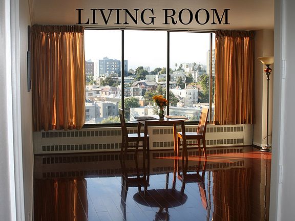 Living room, wall-to-wall windows, cherry-wood floor