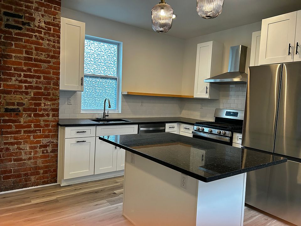 Kitchen with Stainless Appliances and granite tops