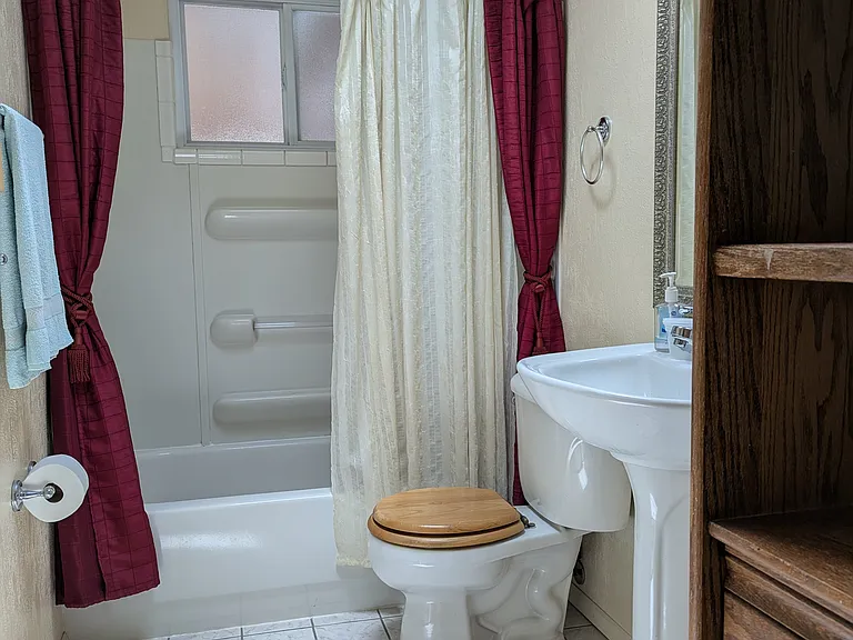 Additional cabinet in the bathroom for linens and things.