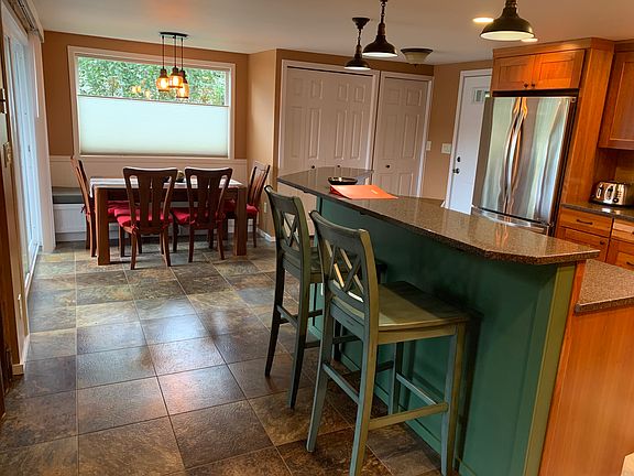 Open kitchen to dining room, living room, tv room and both decks