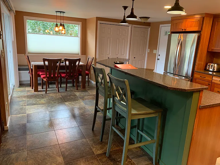 Open kitchen to dining room, living room, tv room and both decks