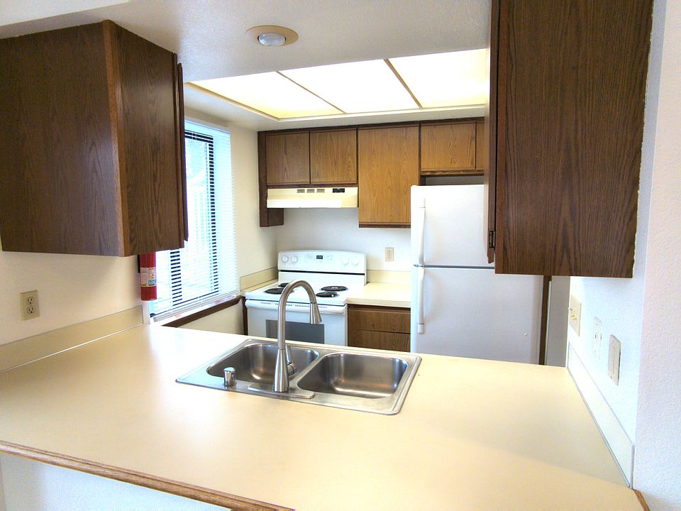 Kitchen with sitting bar.