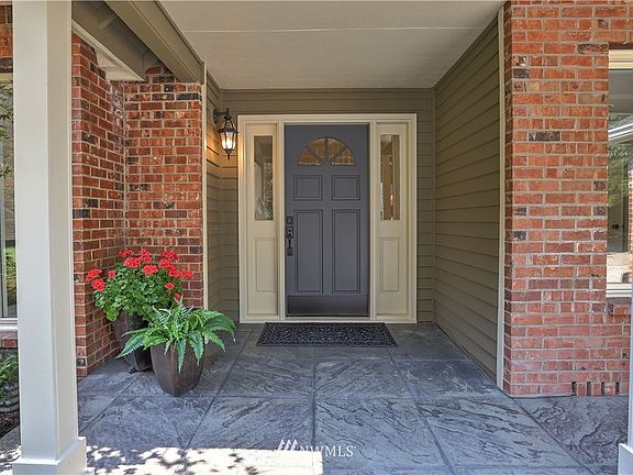 Refreshed landscaping and new (2021) exterior paint welcome you in! 