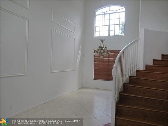 LIVING/DINING ROOMS.  BEAUTIFUL TILE FLOORS.