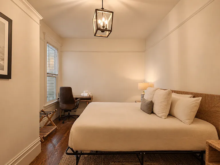 Bedroom #2: Elegantly furnished with a premium king bed and dedicated workspace overlooking iconic Lyon Street. Ample closet space in each bedroom and natural light pours in from window