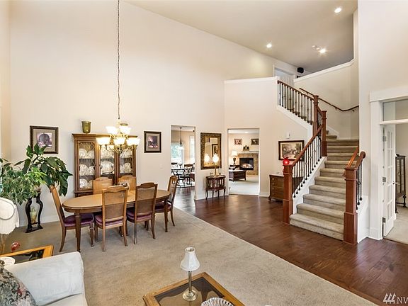 Massive soaring ceilings in your formal living and dining room.  Den with french doors to the right. 