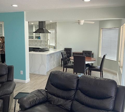 TV area looking back into dining area and kitchen