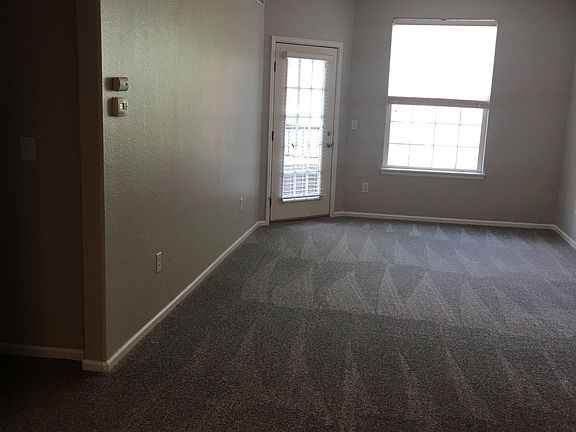 Living room & door to patio. Opposite wall to the fireplace.