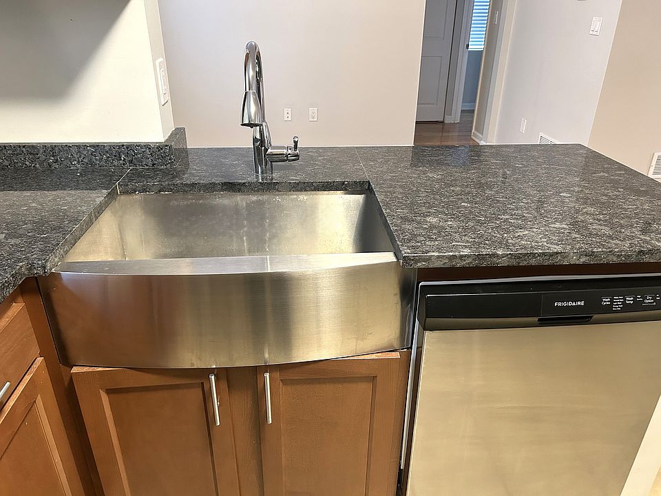 The open-concept kitchen is an entertainer's dream, seamlessly flowing into the dining area, perfect for hosting friends and family.
Dishwasher and garbage disposal.