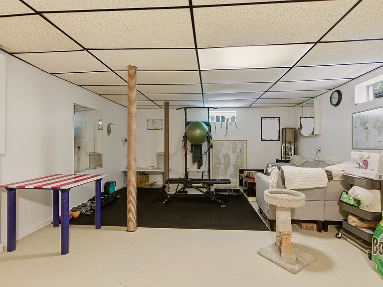 Finished basement with gym, full size fridge/freezer, chest freezer, front load washer and dryer.