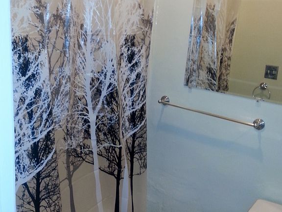 bathroom with shower over tub