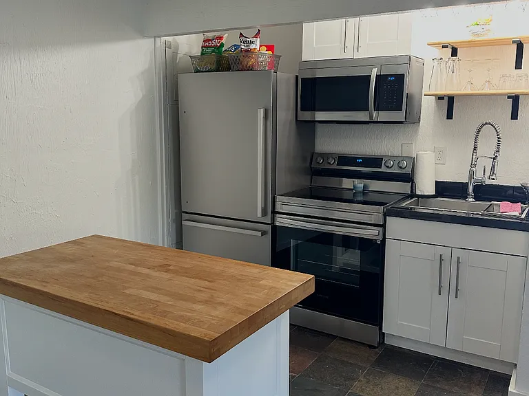 galley kitchen with full-size appliances and island