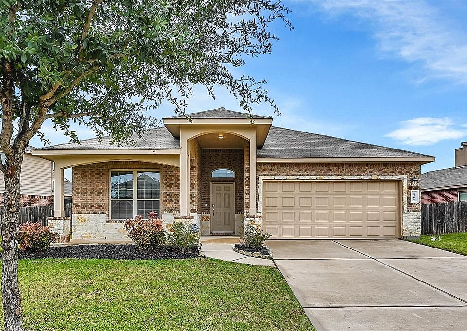 This charming facade includes an extended covered entryway (so all your Amazon deliveries don't get soaked!) and a covered porch area perfect for a couple of rocking chairs.