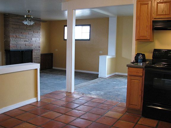 family room with fireplace from kitchen