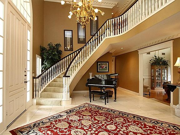 A breathtaking entry with abundant natural lighting and warm color palette welcome you into this beautiful home.