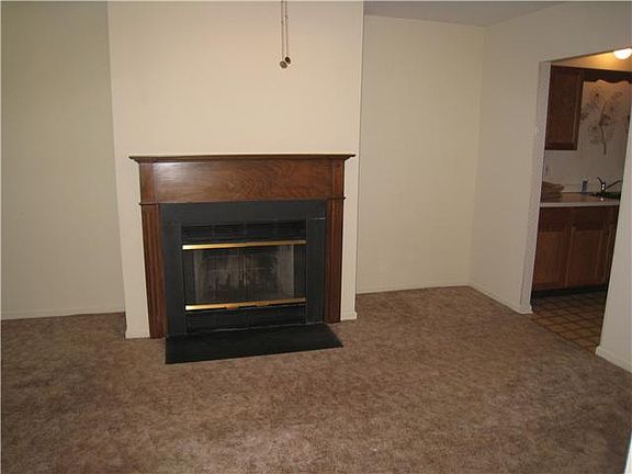 Fam. Rm. (cont.) w/carpeting and fireplace