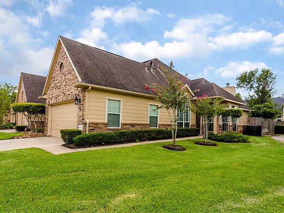 A wide driveway leads from the street to the two car garage offering homeowners and guests plenty of off street parking. Bonus: The upstairs attic has been built out and is lined with natural cedar planks and it climate controlled (11X11)!