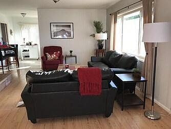 Front room overlooking the front of the room. Sunny and bright and great for cozying up with a good book