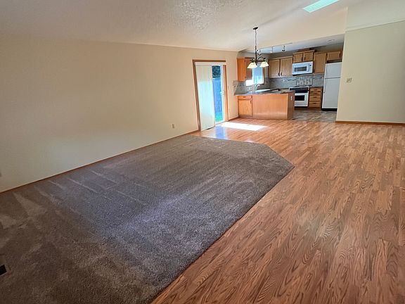 Great room with vaulted ceilings and sky light