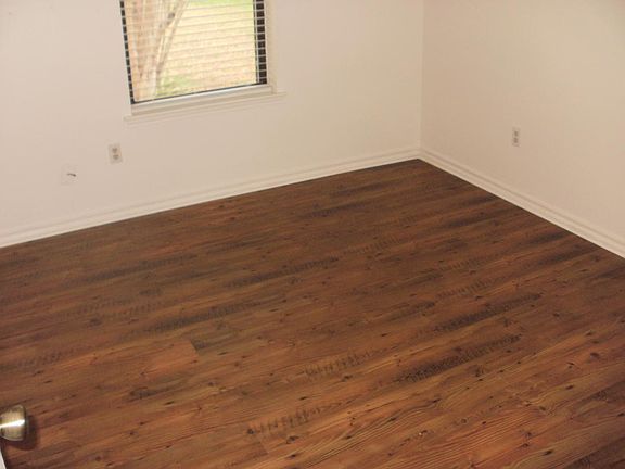 Laminate wood flooring in all bedrooms