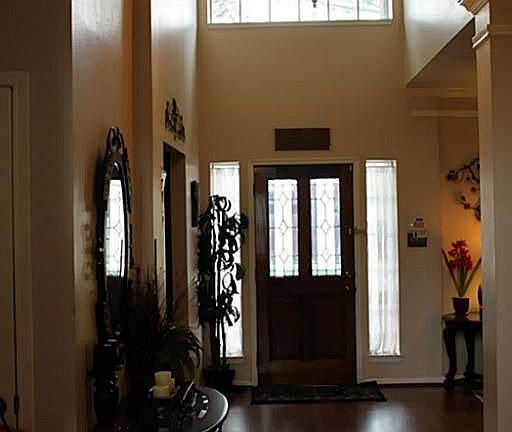 Rich wood front entryway welcome you to an attractive floor plan
