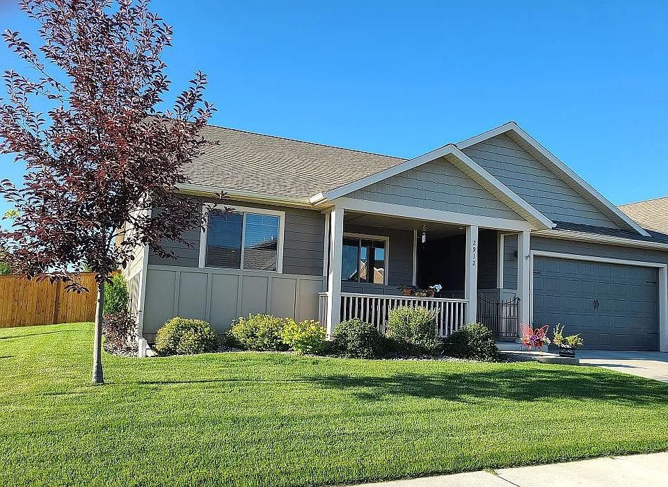 Front view off house and 2-car garage