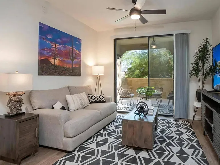 Living Room with Ceiling Fan and Patio Access