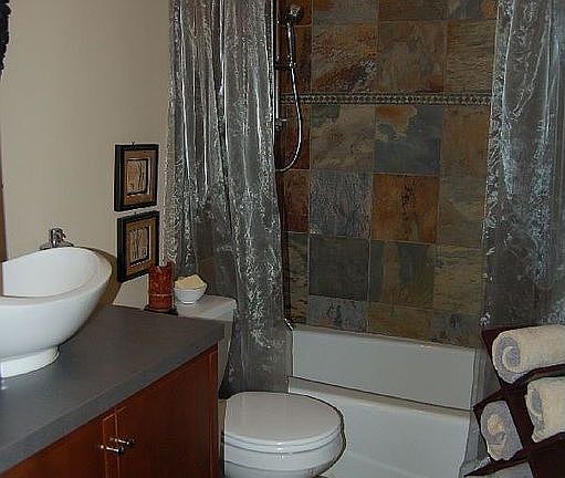 Dramatic Guest Bath w/ natural slate & floating sink