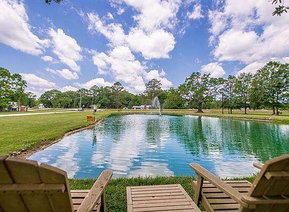 Pond in front of house