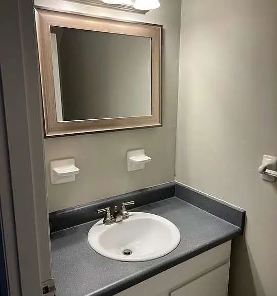 Elevate your lifestyle at Arbor Terrace with this chic and modern bathroom, featuring sleek finishes and ample storage. Perfect for your daily routine, this space combines functionality with style. Schedule a visit today to see more!