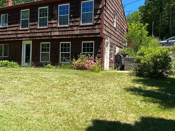 Older photo; right side of building. Access from front, side, rear.