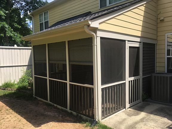 Screened in back patio and outside slab.