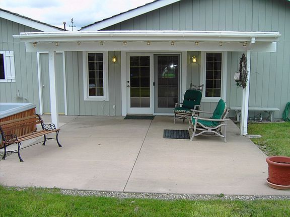 Covered patio and hot tub