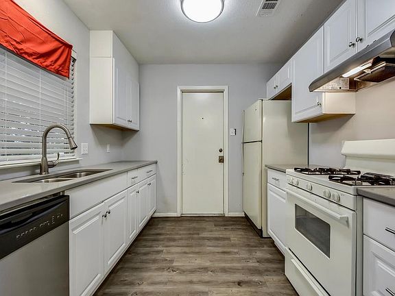 Kitchen looking towards garage entrance.